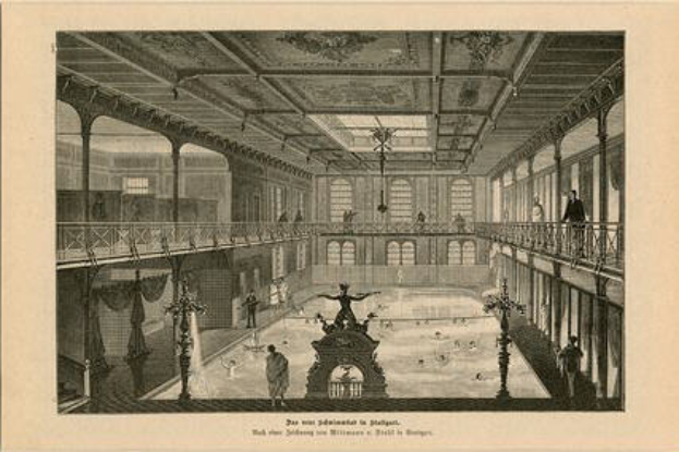 Eine Gravur eines großen Raums mit einer Fontäne in der Mitte, umgeben von Menschen, Säulen, Fenstern und einer Decke, mit der Inschrift "Die Eislaufhalle im Schloss Versailles" unten.