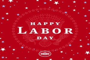 Plakat mit "Happy Labor Day" in fetten weißen Buchstaben auf einem hellroten Hintergrund, umgeben von mehrfarbigen Sternen verschiedener Größen.