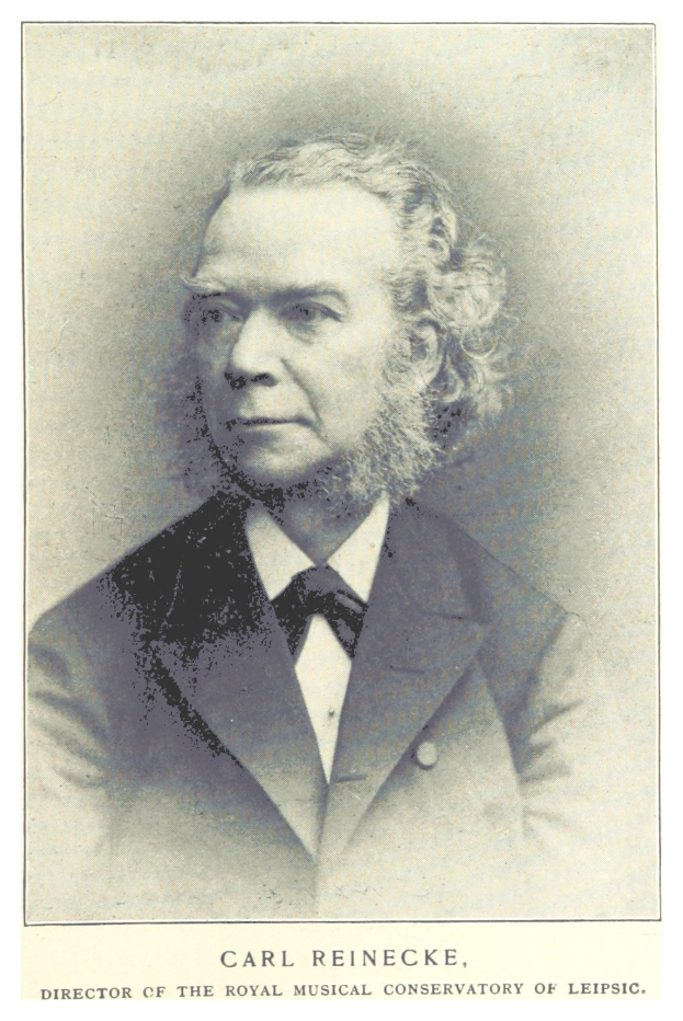 Schwarzes und weißes Porträt von Carl Reinecke, Direktor der Königlichen Musikhochschule Leipzig, in einem Anzug, mit Text unten.